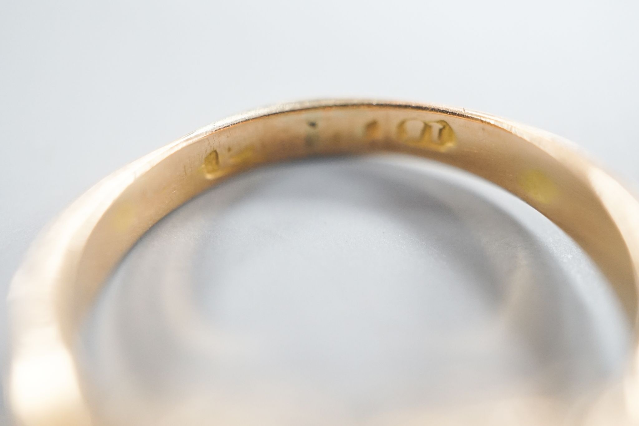 A late Victorian 15ct gold, garnet and emerald set dress ring(stone missing & stone replacement?), size L, gross 2.2grams.